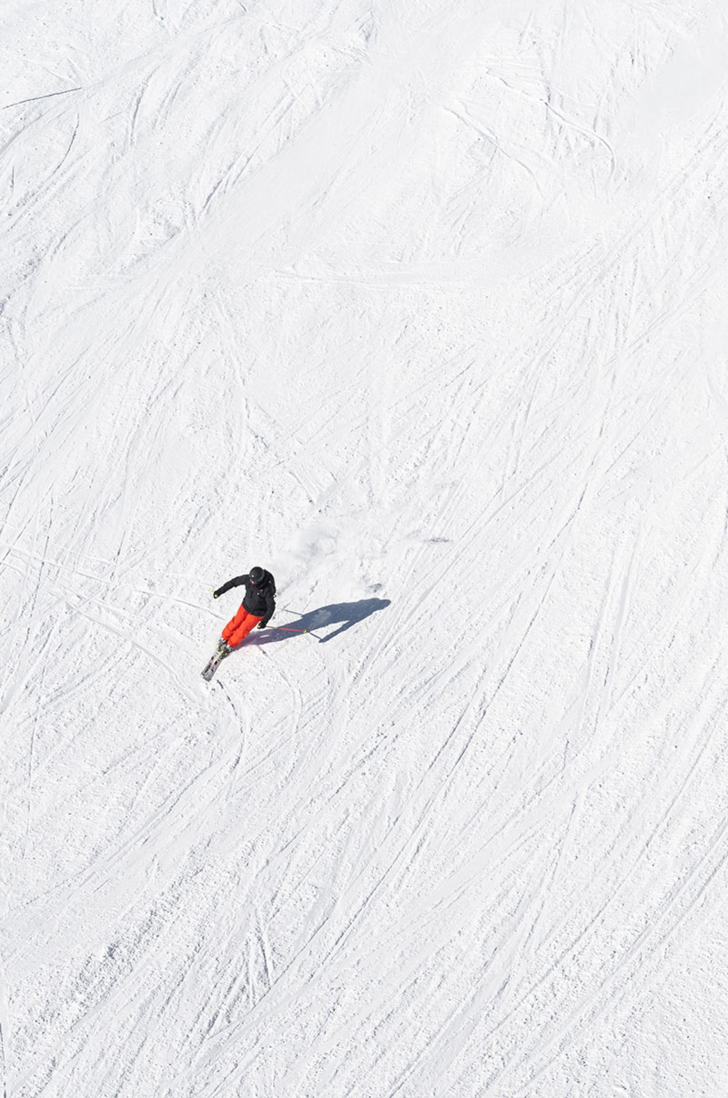 Skier carving a turn on the slopes of the Arlberg near St. Anton