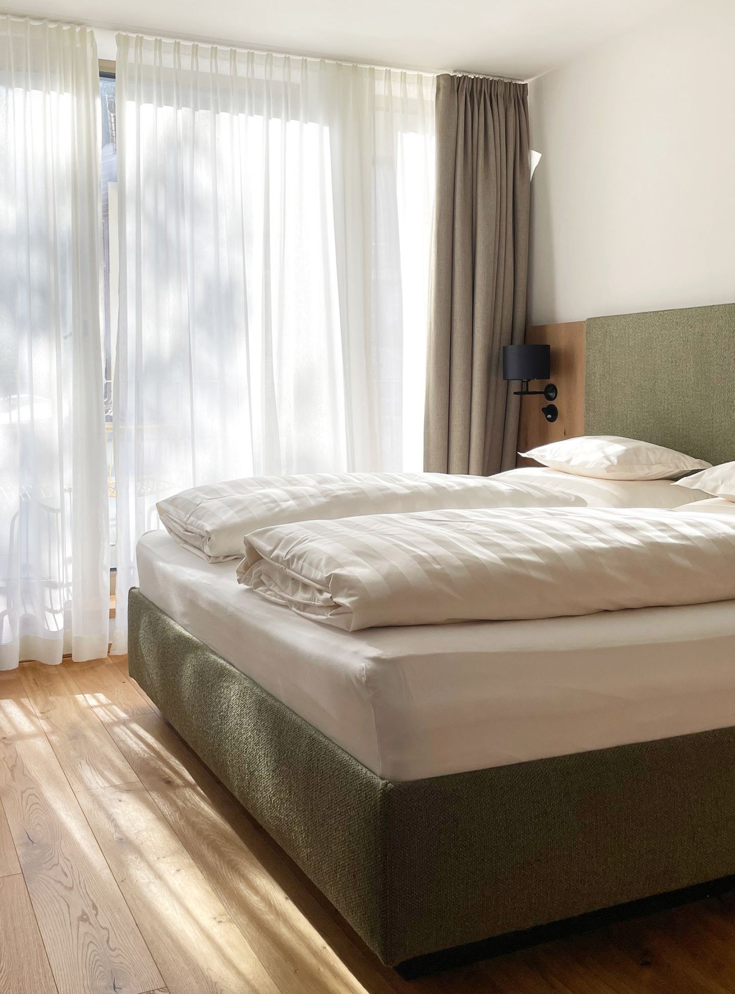 Bedroom with boxspring bed in Omaela Apartment 2 in St. Anton