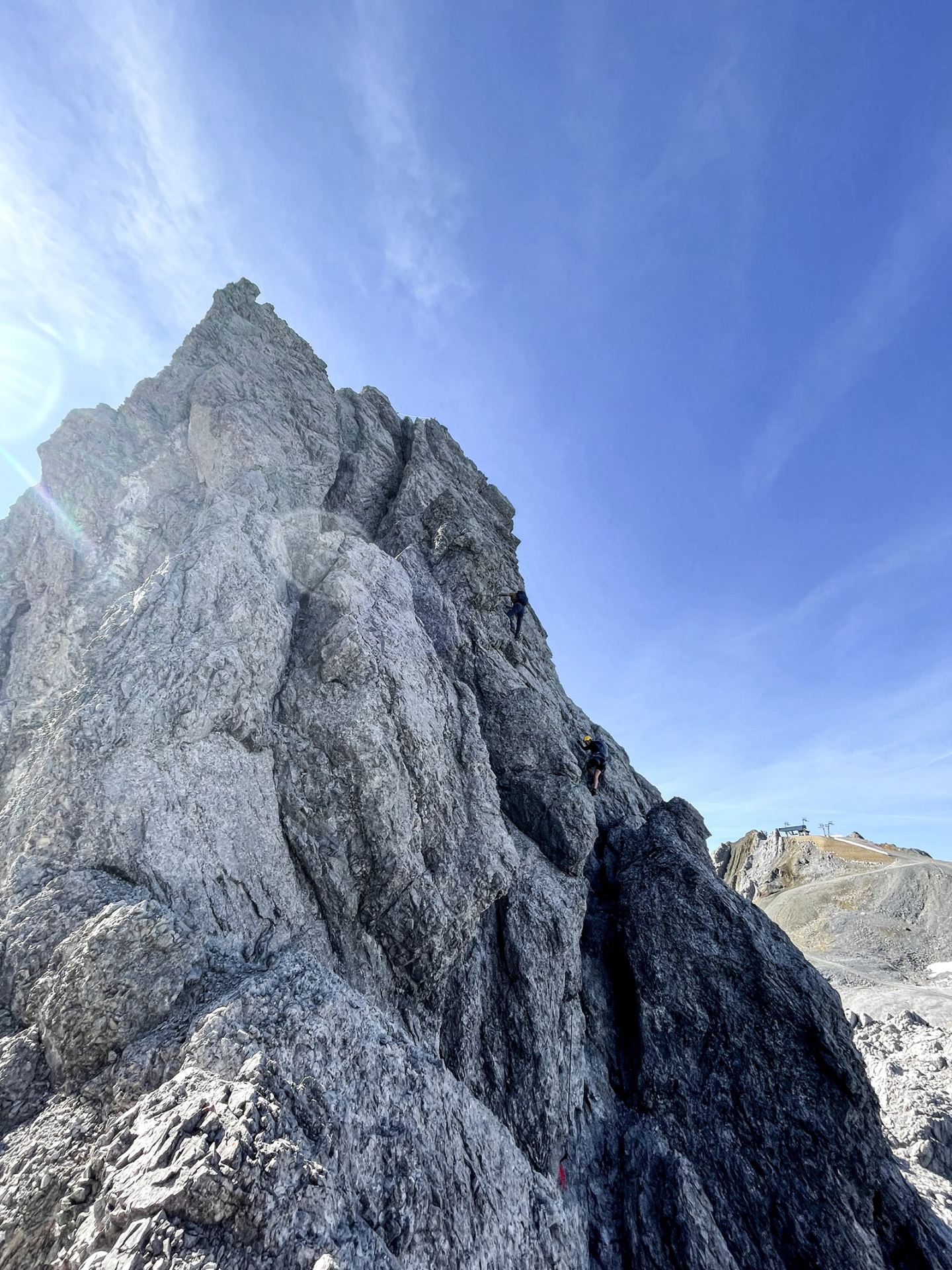 Mountaineer on a steep rock face on the via ferrata above St. Anton am Arlberg
