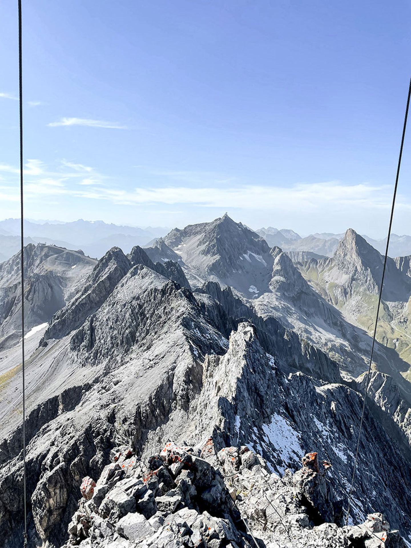 Summit panorama of the rugged Arlberg peaks seen from the mountain station