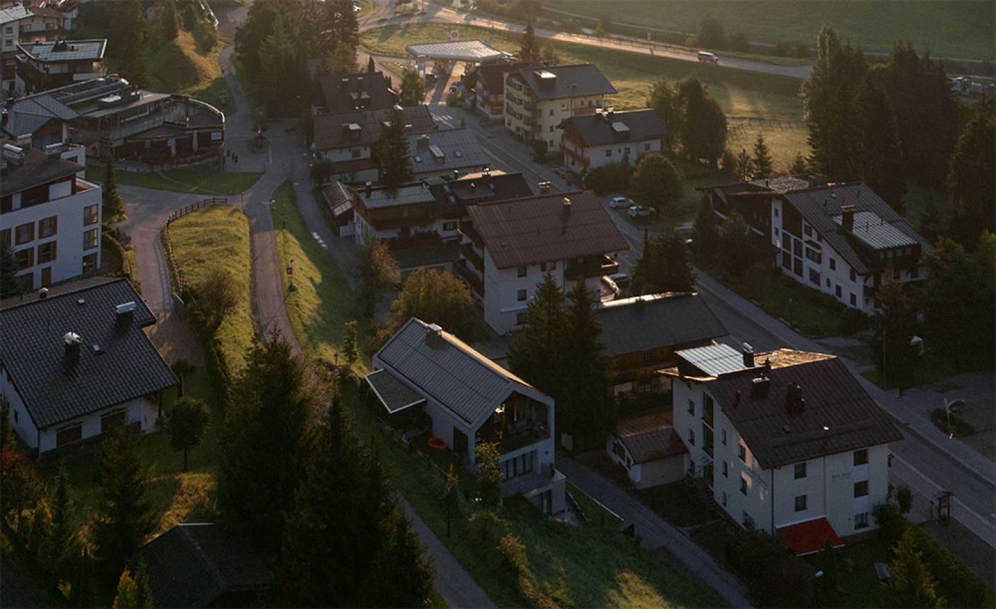 Aerial view of St. Anton am Arlberg in the evening light with the Omaela Apartments