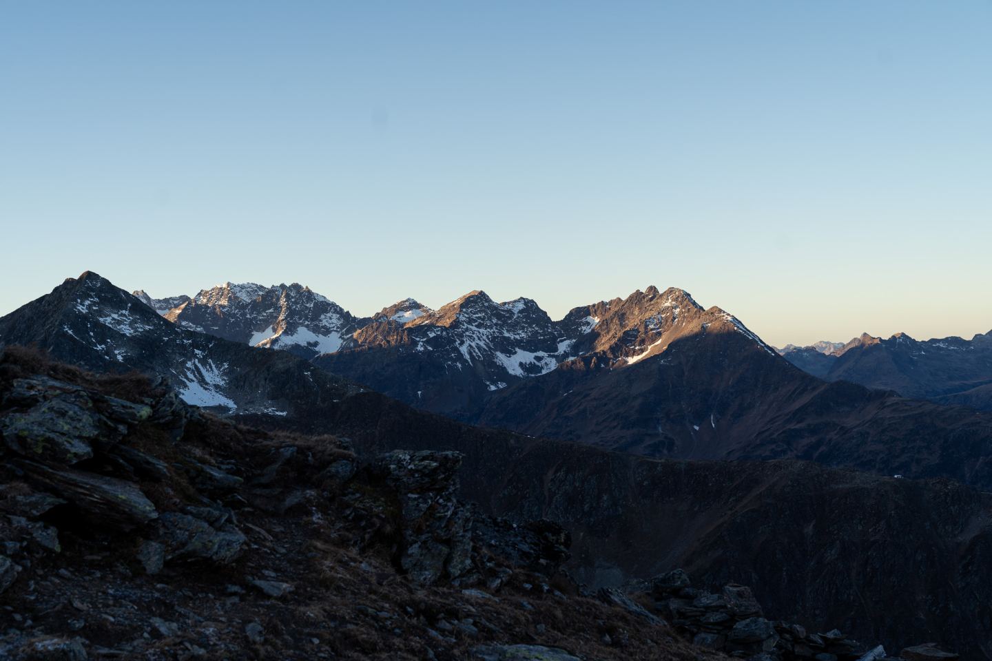 Snow-dusted mountain ridges in the soft dawn light on the Arlberg