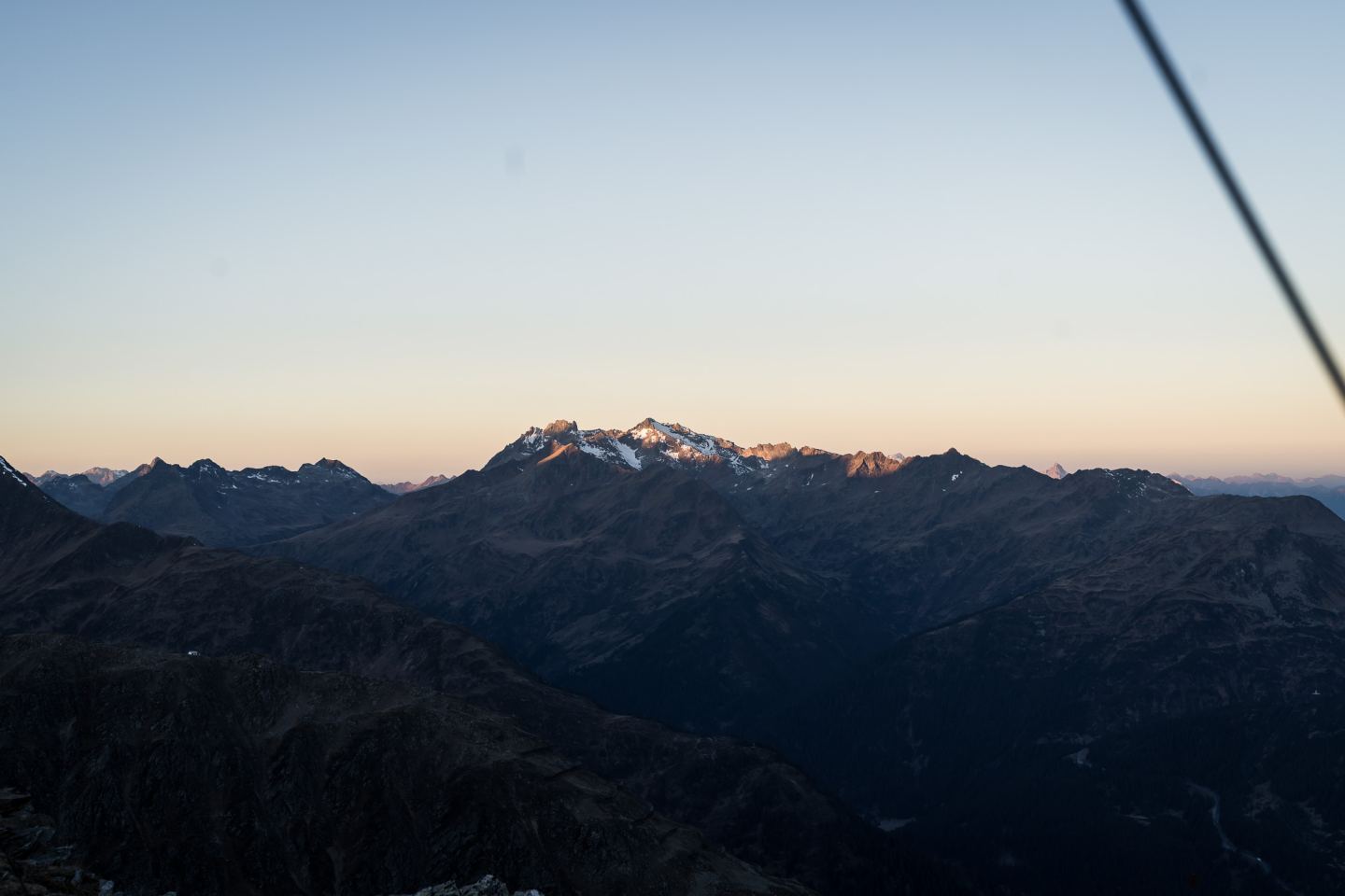 Mountain massif with alpenglow at dusk on the Arlberg